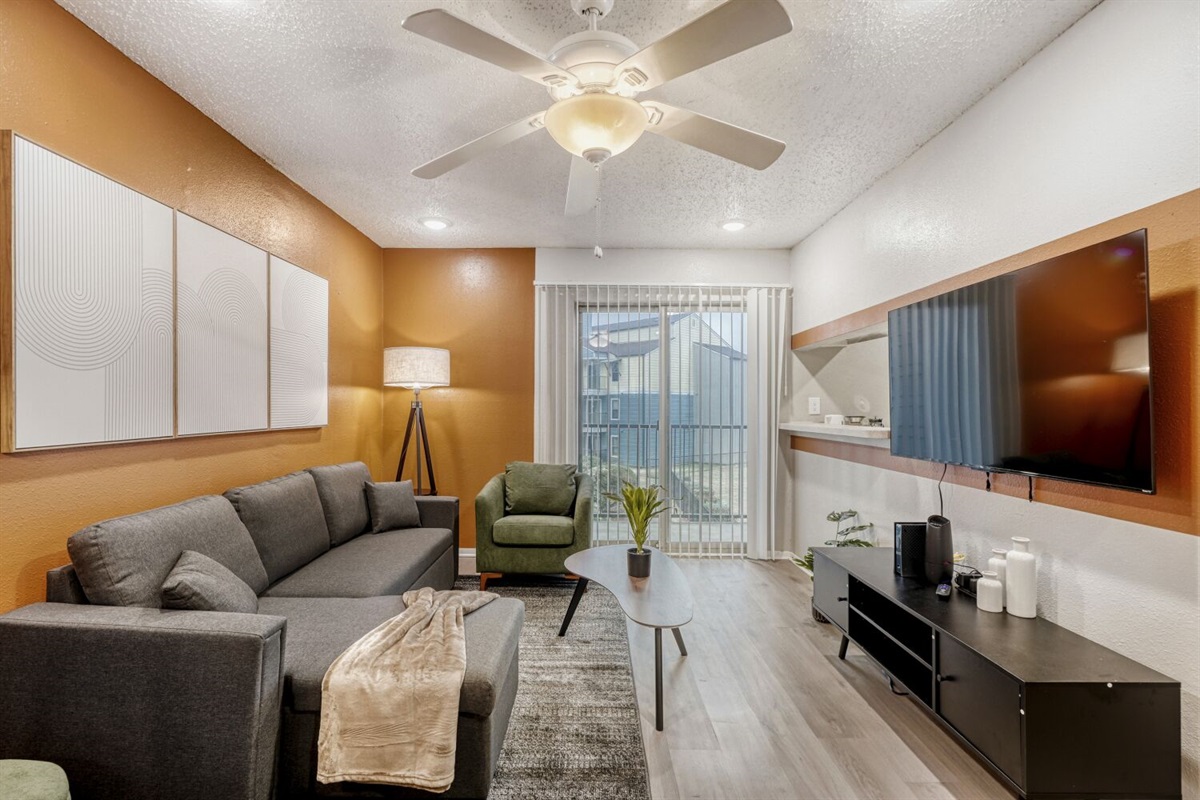 Modern warmth meets cozy comfort in this stylish living room.