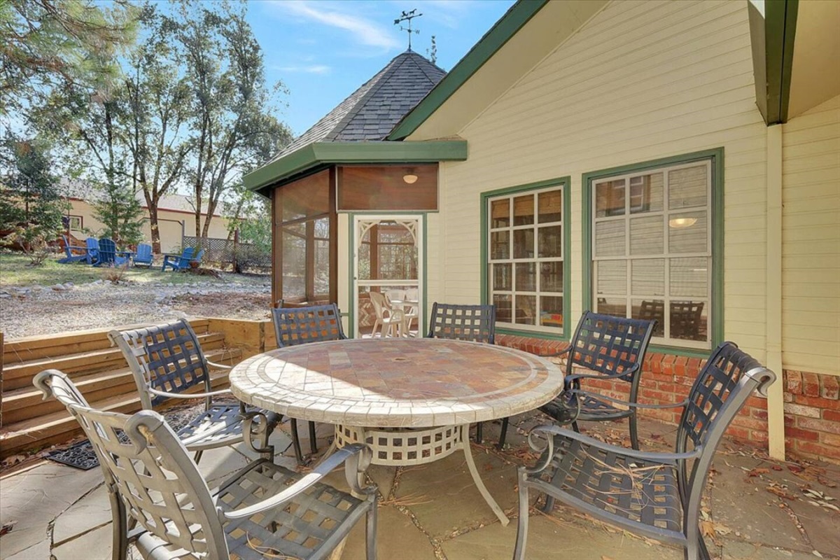 Small patio with outdoor dining, screened porch access, and a tucked-away spot for fresh air.

