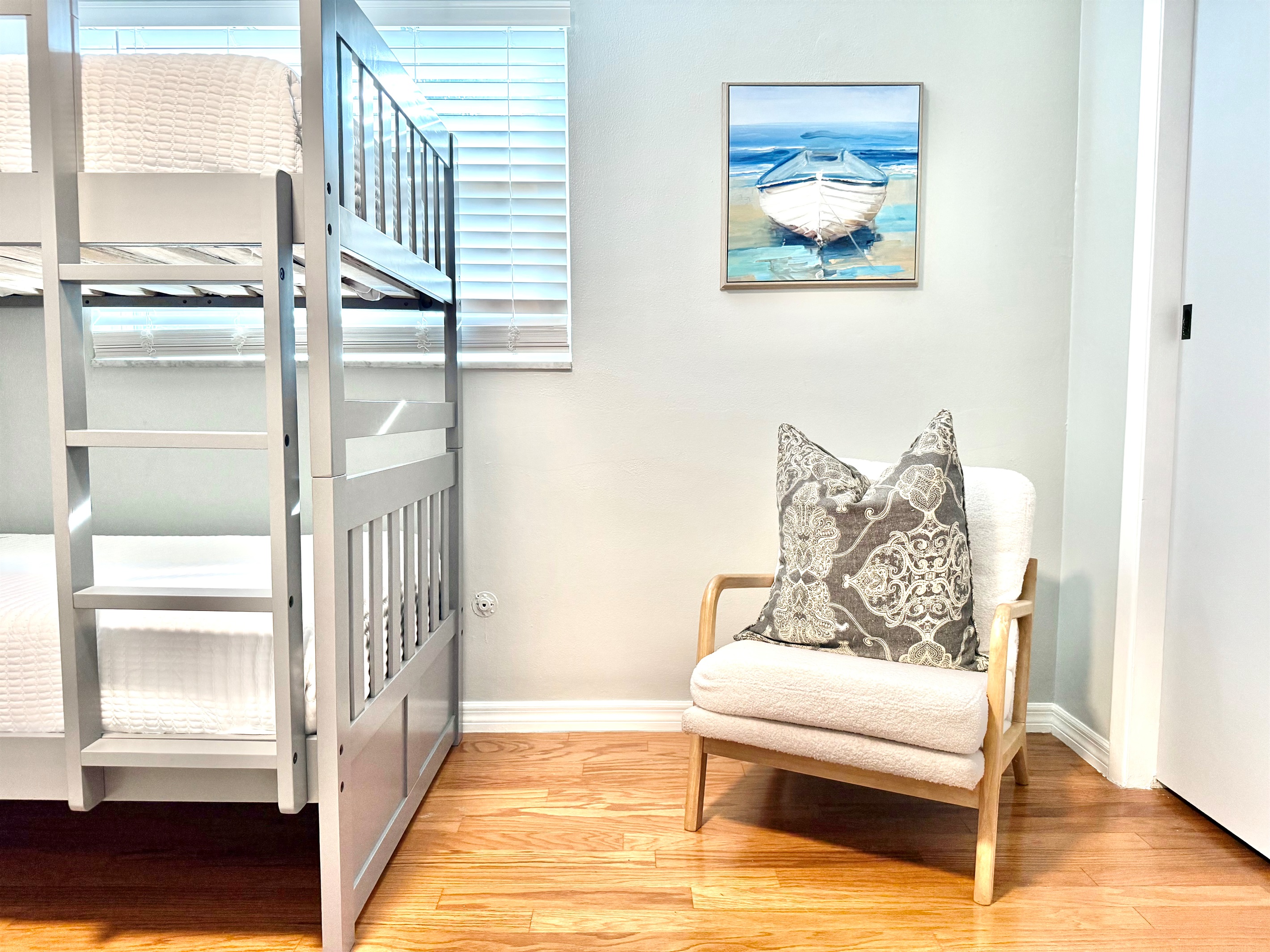 Comfortable, practical, and stylish, this room features two sets of sturdy twin bunk beds ideal for large groups.