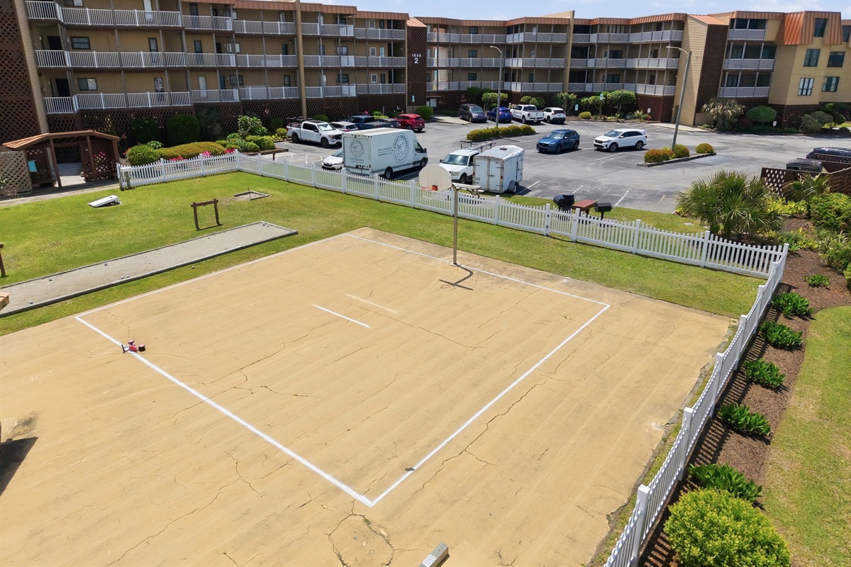 Community basketball court and playground area for outdoor fun and family activities