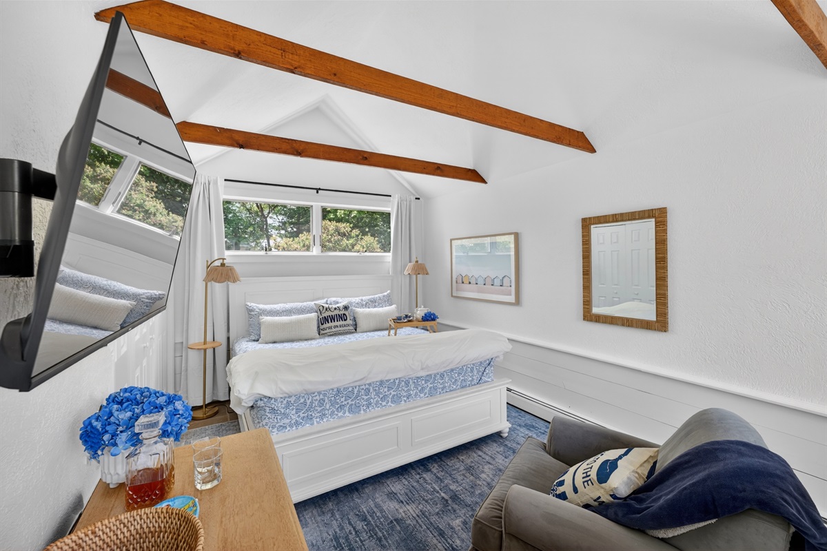 First-floor king suite with private attached bathroom and blackout shades, ideal for stair-free comfort and restful stays.