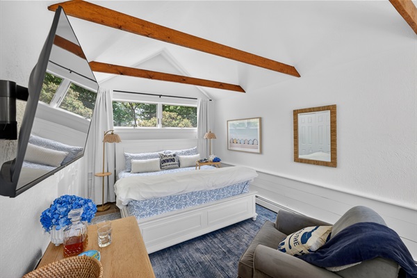 First-floor king suite with private attached bathroom and blackout shades, ideal for stair-free comfort and restful stays.