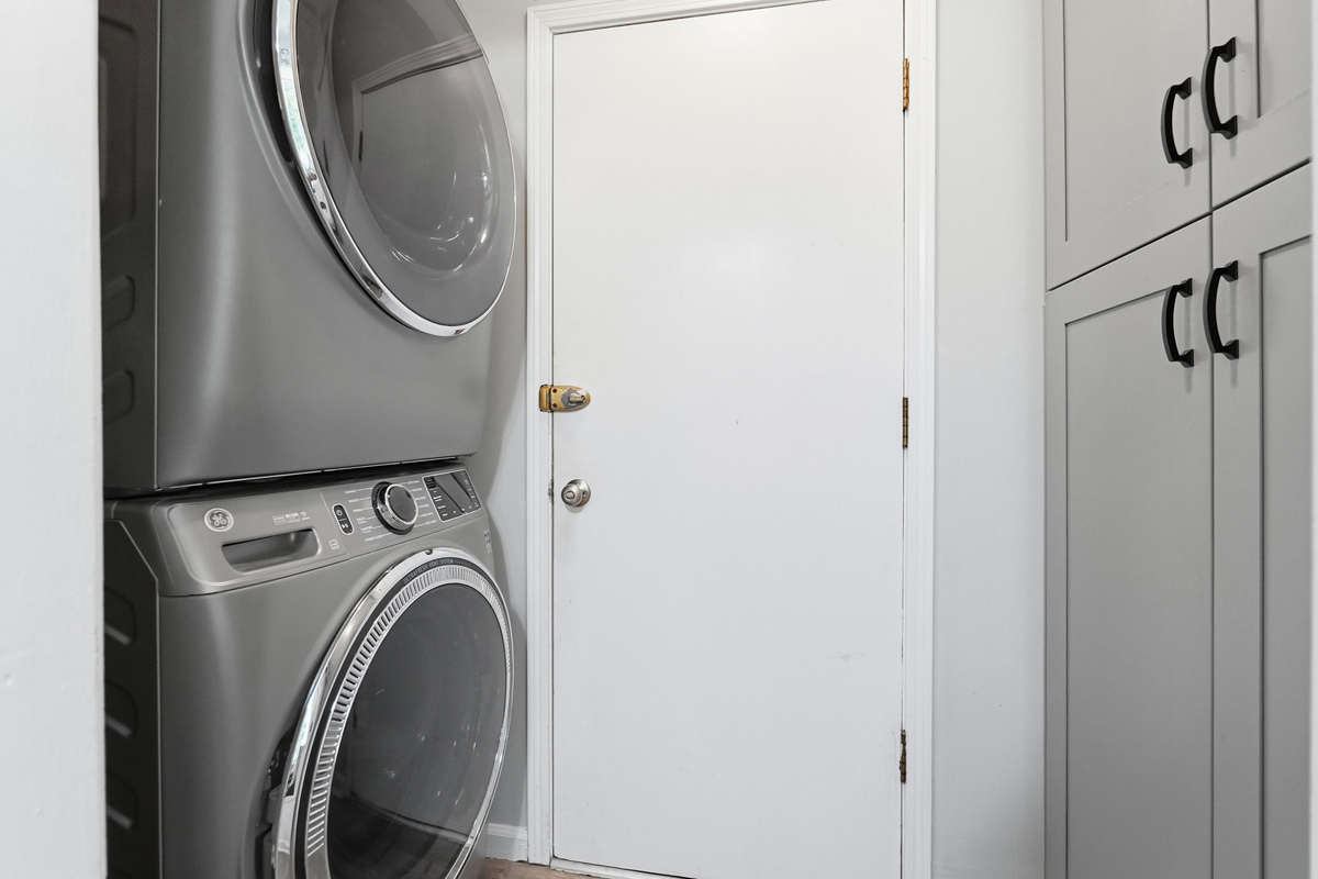 A stacked washer and dryer are available inside the home for convenient mid-stay laundry.