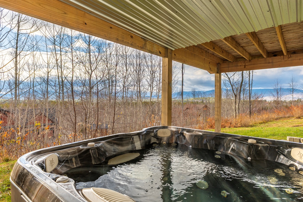 Your cozy mountain escape comes complete with a private hot tub.