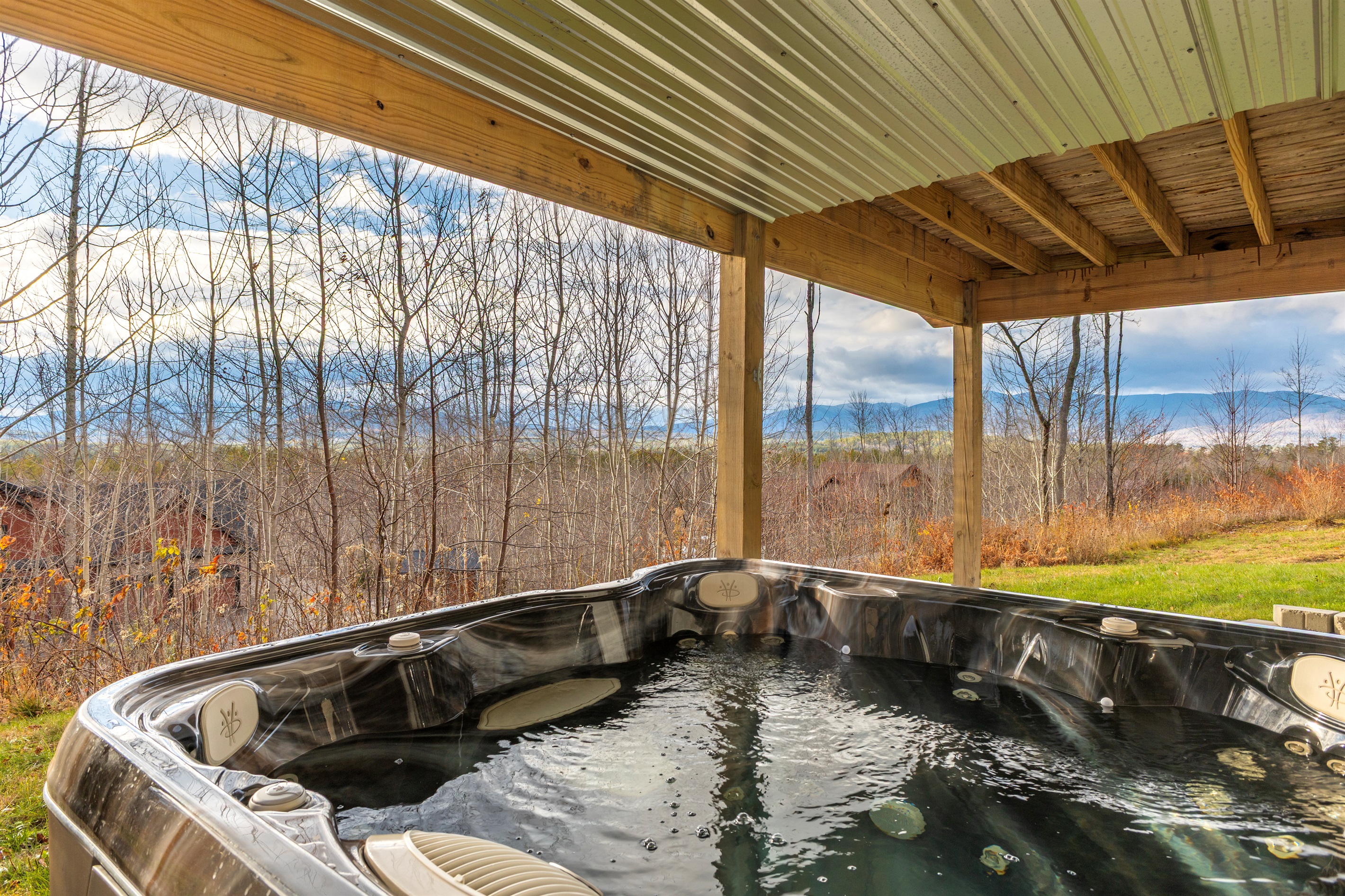 Your cozy mountain escape comes complete with a private hot tub.