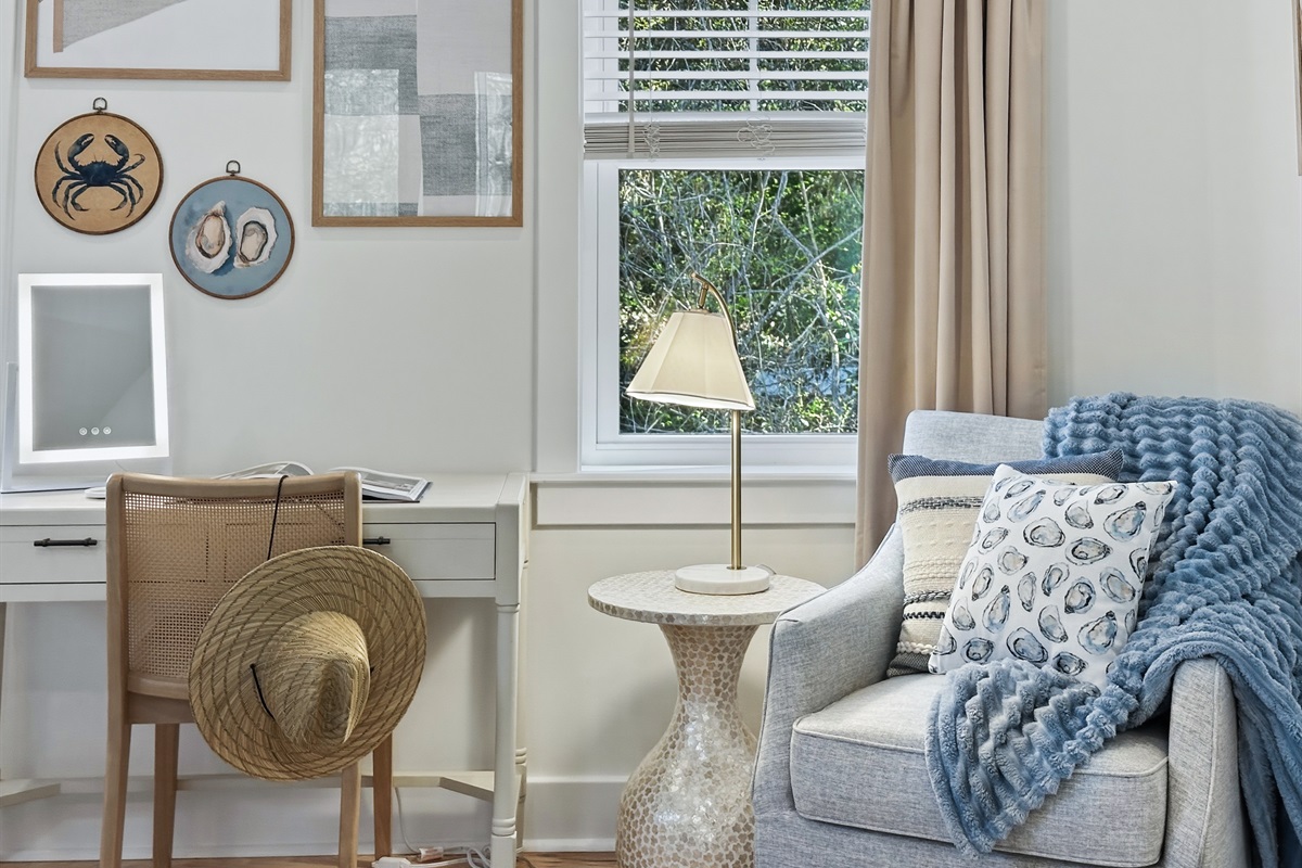 With a cozy reading corner and a vanity station.