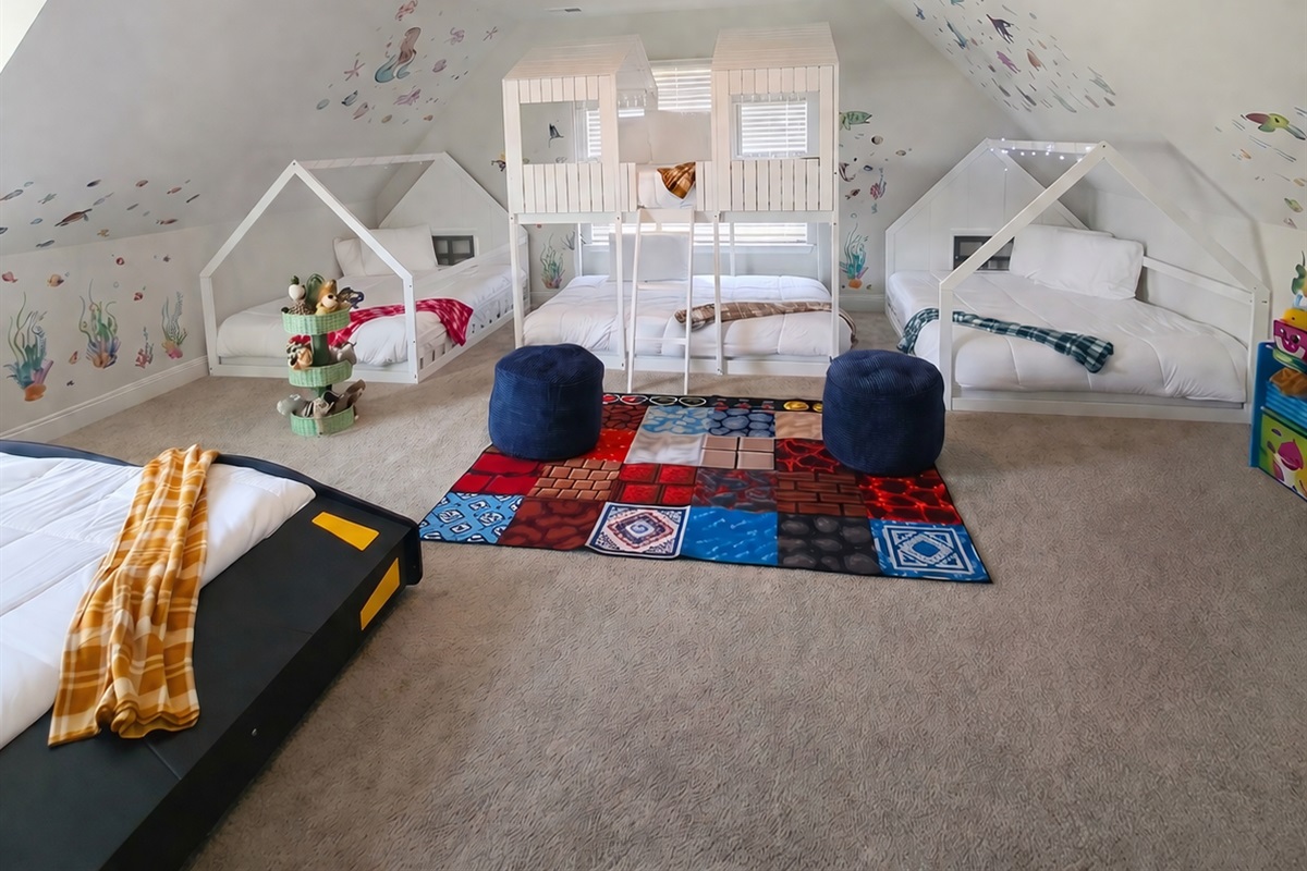 Kids Room: Imagination thrives in this vibrant space with fun house beds and playful decor!