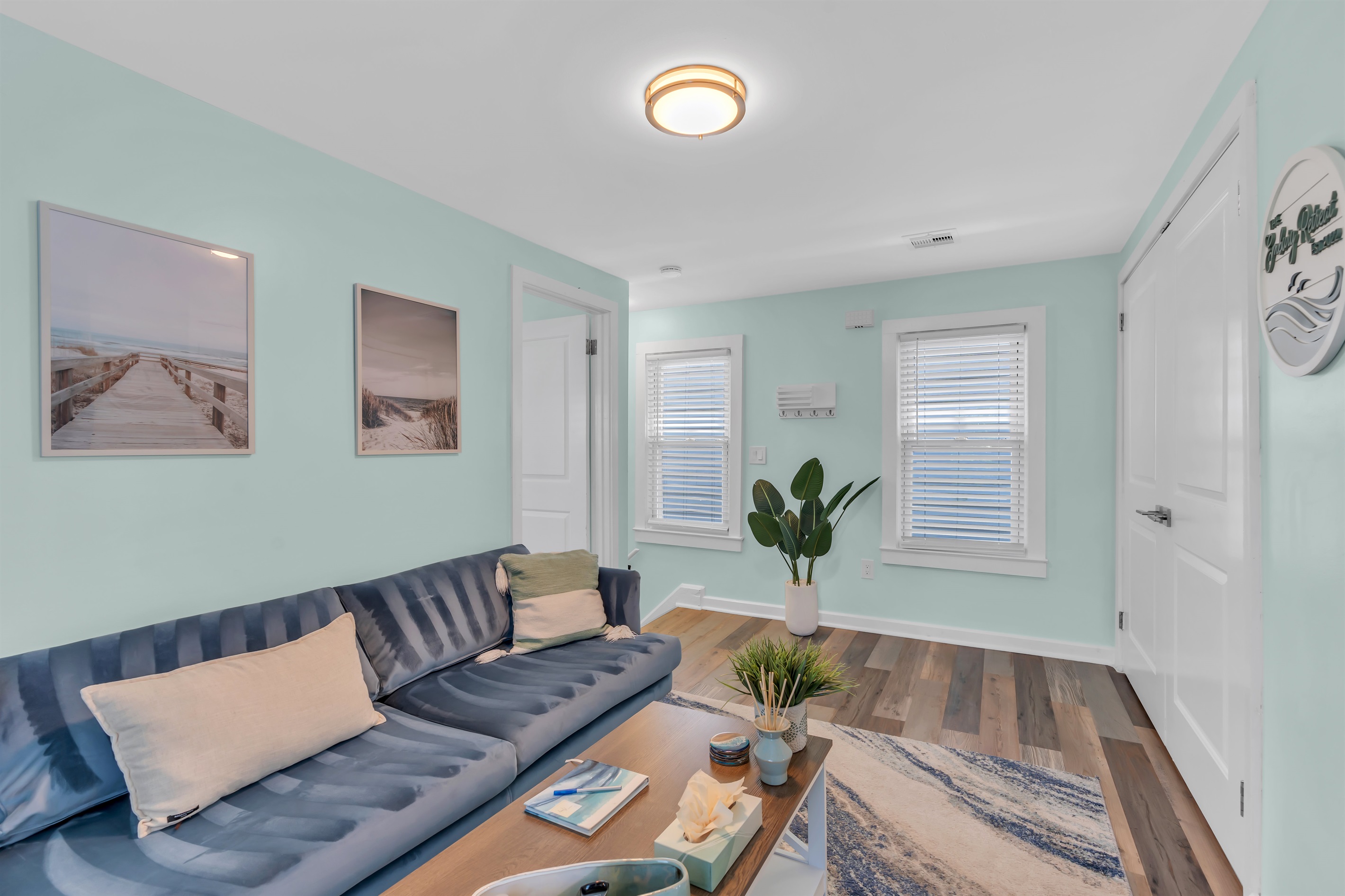 Unwind in our bright, airy beach apartment near Asbury Park. Modern furnishings, beachy artwork, and luxury vinyl plank floors create an inviting space for your Jersey Shore getaway.