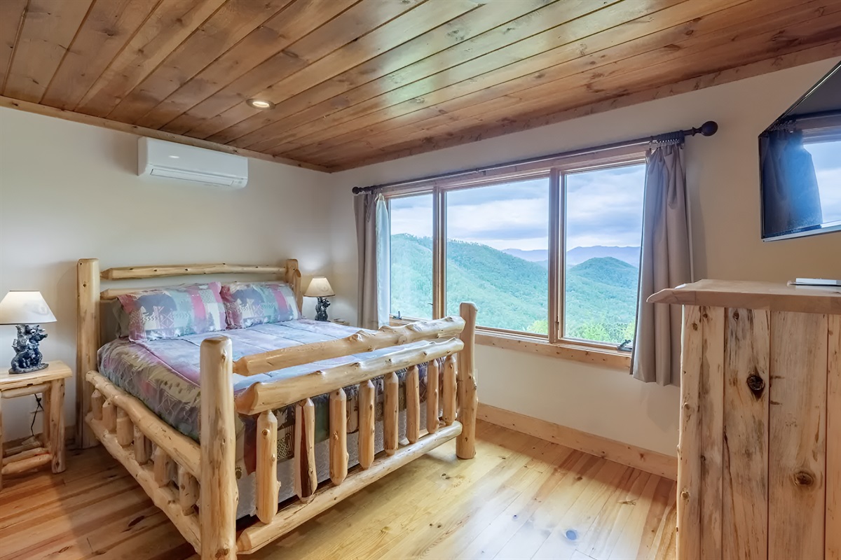 The upper level queen-sized bedroom has great views and a personal TV.