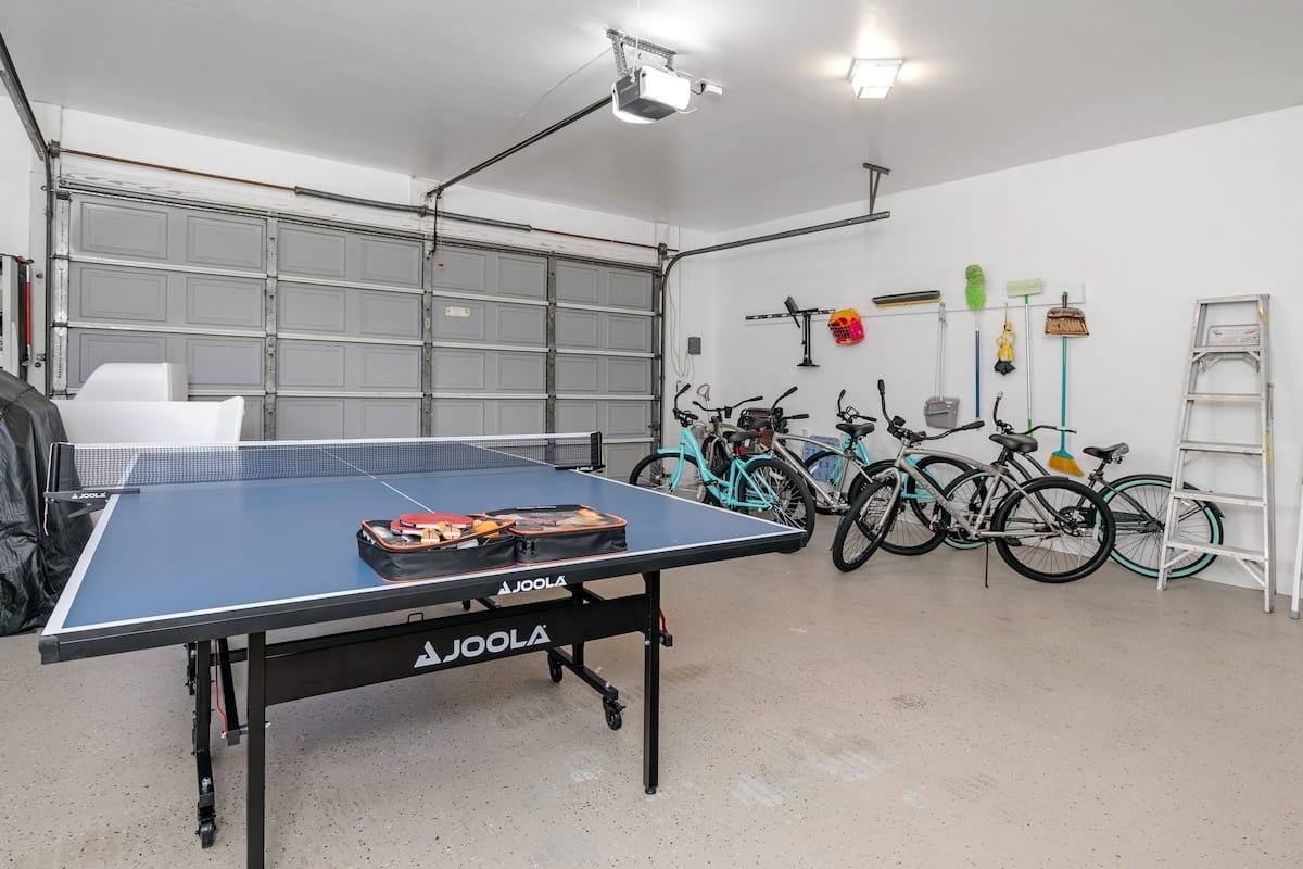 Garage perks: ping pong table, five bikes, BBQ, and cornhole. 