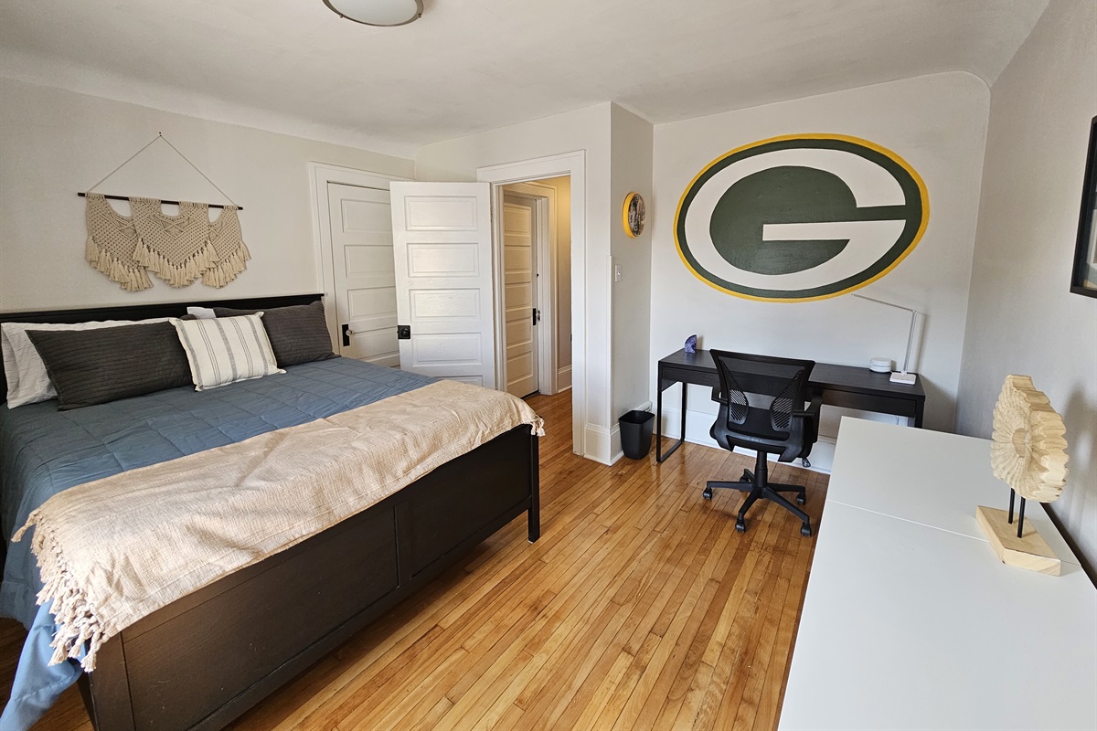 Bedroom 2 with custom Packer's mural and works space