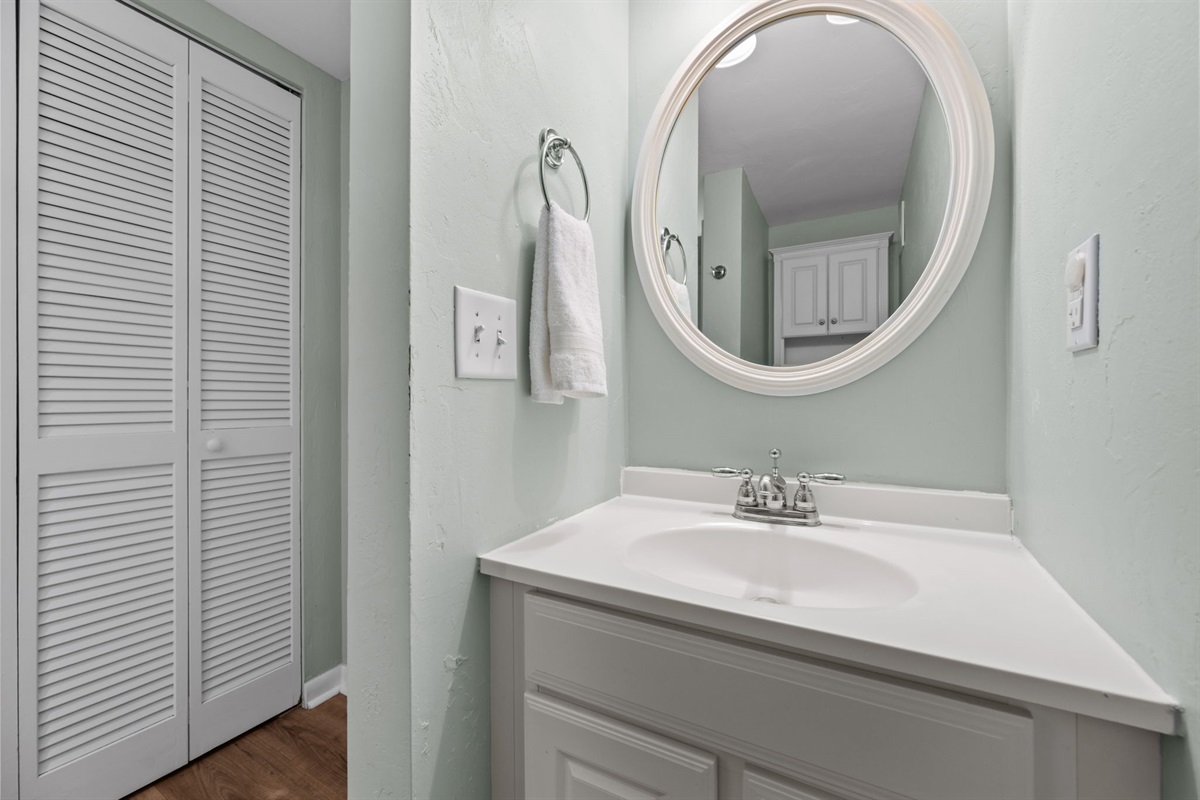 Private bath featuring a bright vanity and convenient layout