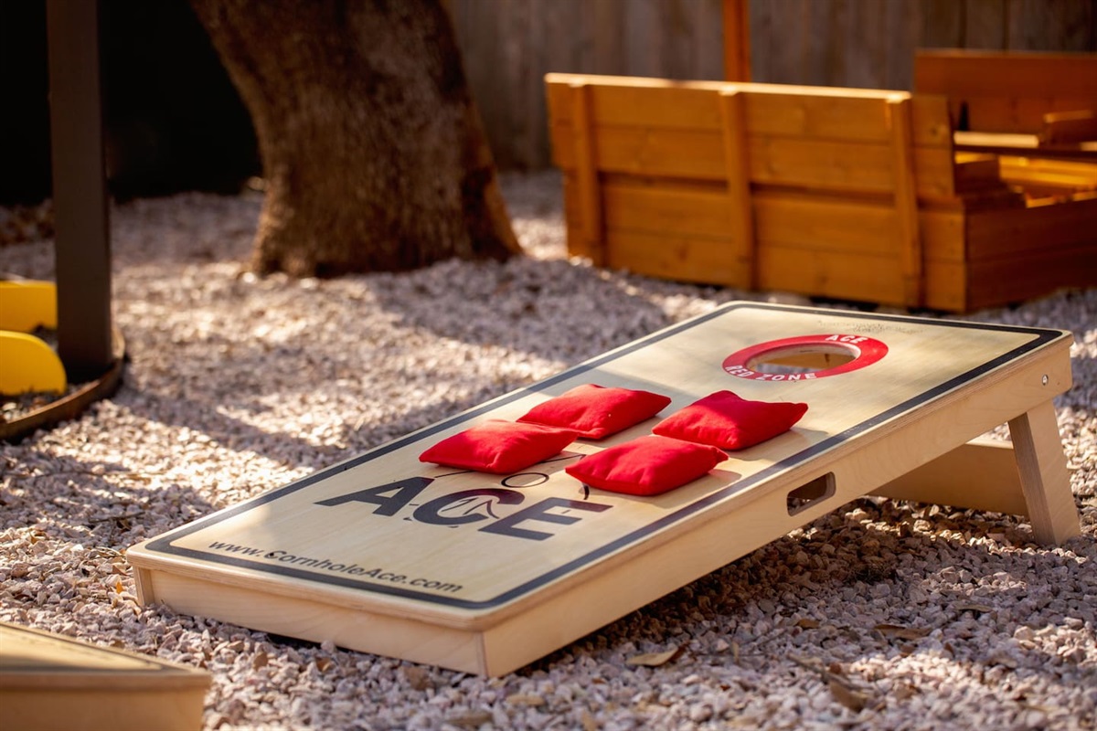 Backyard bragging rights start here—with a friendly game of cornhole. 