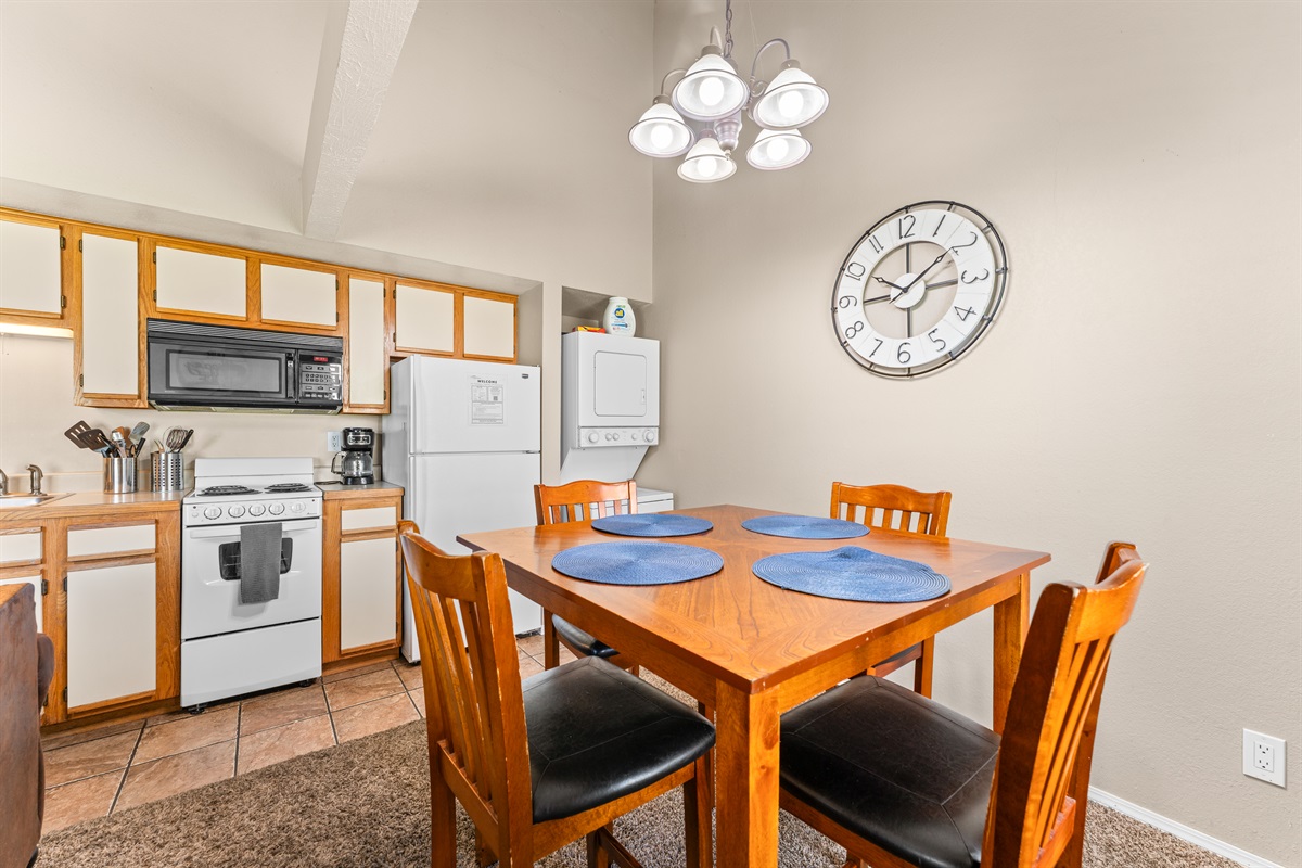 Easy meals and game nights start here, with dining and kitchen side by side.