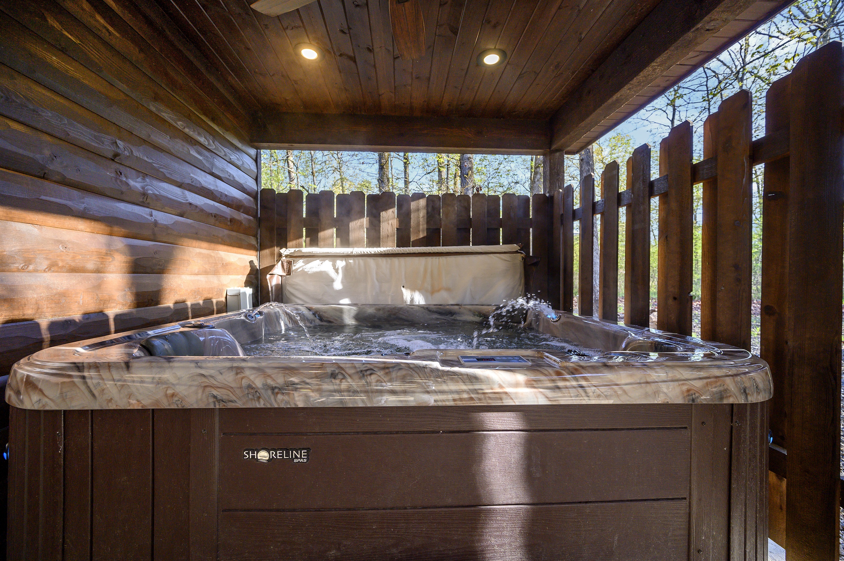 Private covered hot tub for relaxing after a day in Broken Bow.