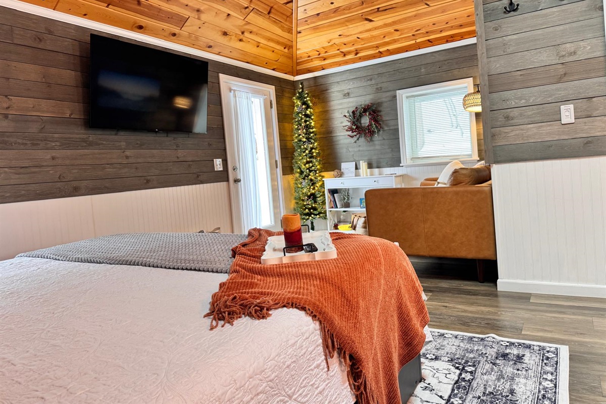 Cozy winter retreat with comfy bedding, bright, comfy lounge with holiday charm