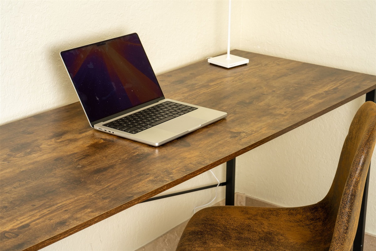 This space doubles as a guest room and home office, with a daybed for relaxation and a desk for productivity.