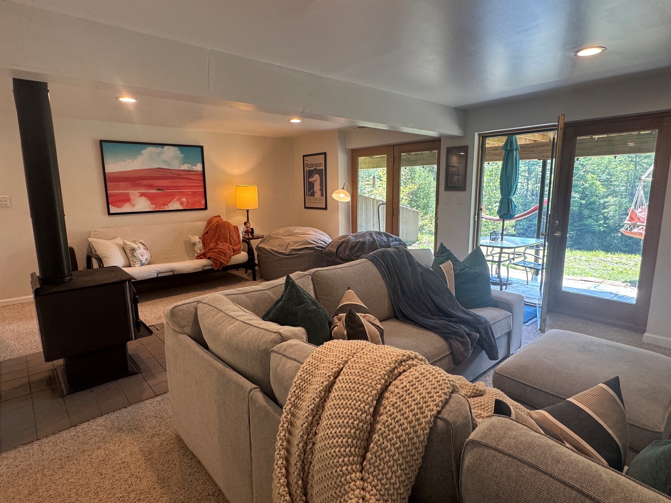 Comfy couch, and a futon, walk-out to patio