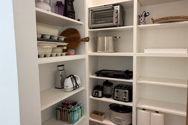 Large pantry provides small appliances and ample space to keep groceries organized