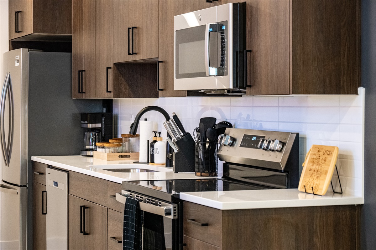 Downstairs Unit: Fully equipped kitchen ready for home-cooked meals and morning coffee.