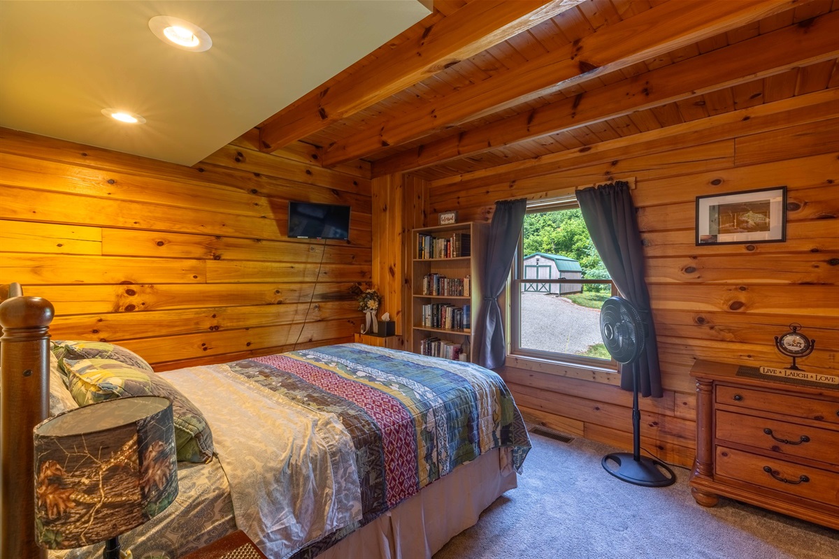 This is one of two bedrooms on the main floor, complete with books for your reaading enjoyment!