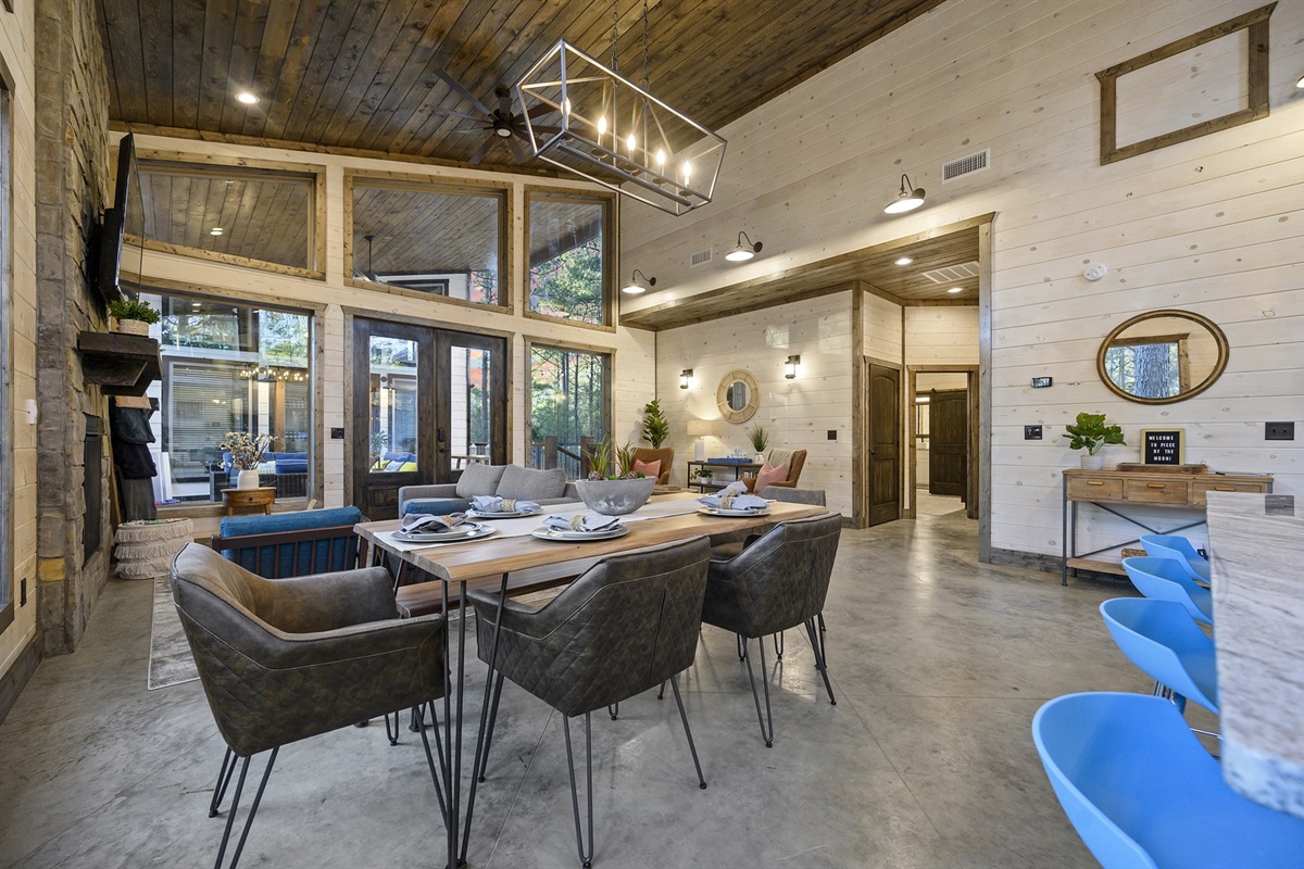 Invite everyone to linger a little longer. Soft lighting, a crackling fire, and a roomy dining table create the scene for long dinners, card games, and easy conversation late into the evening.