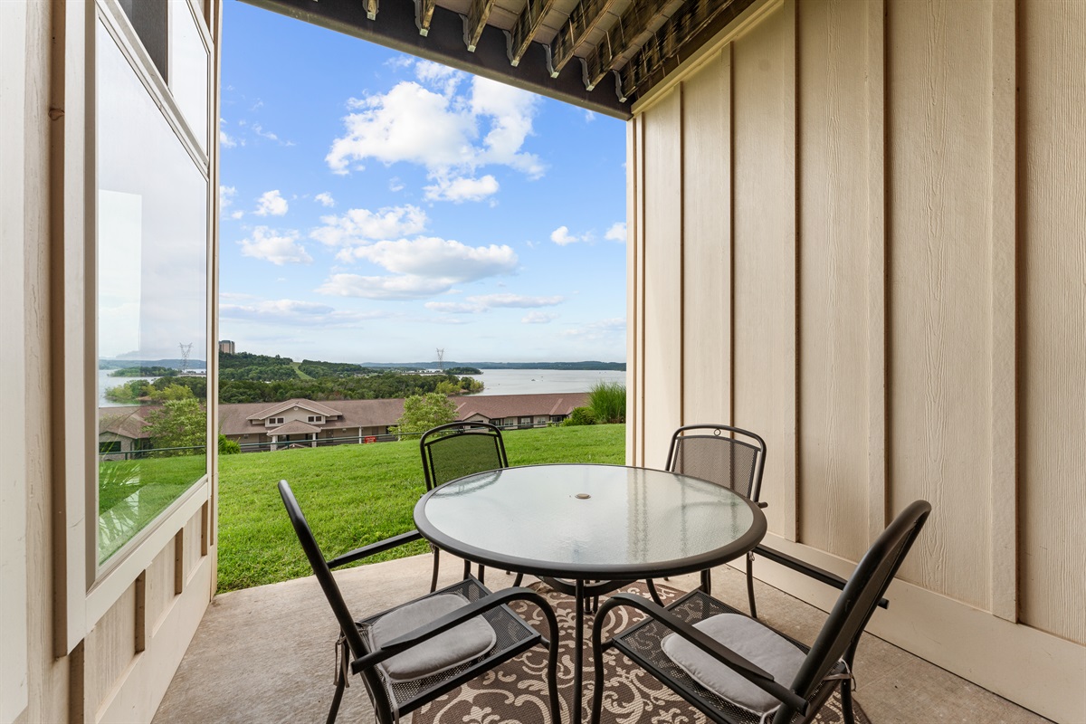 Step onto the covered patio for fresh air, a quiet drink, and one more look at the lake.