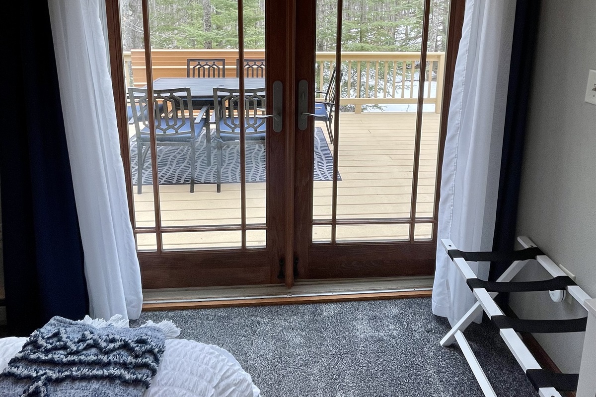 French doors to the back deck out of master queen bedroom 