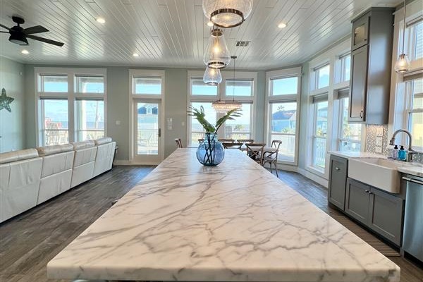 Crystal Paradise Kitchen: Bright, open kitchen featuring luxurious marble surfaces and generous space for gatherings.