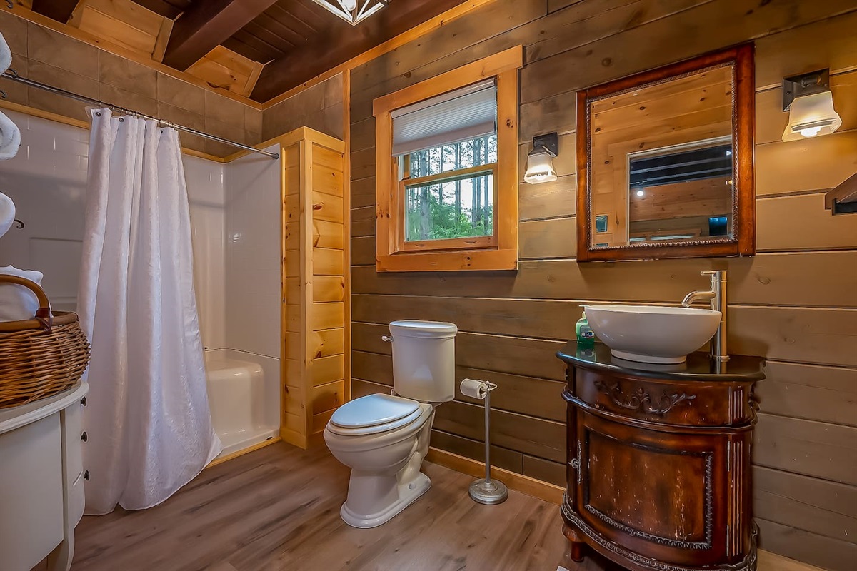 Main floor bathroom with large walk in shower. There are 5 steps to get to main level with a full bath and bedroom on main level.