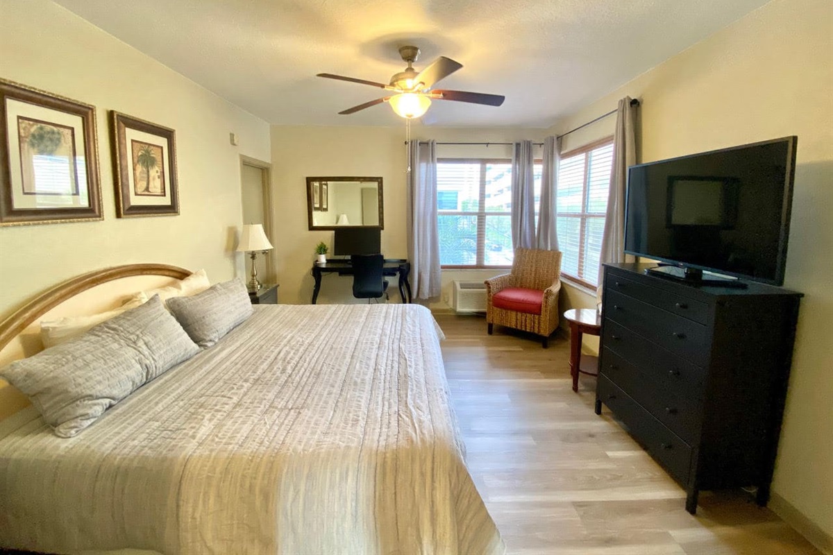 Bright bedroom with desk space for remote work, should you need it - we have it