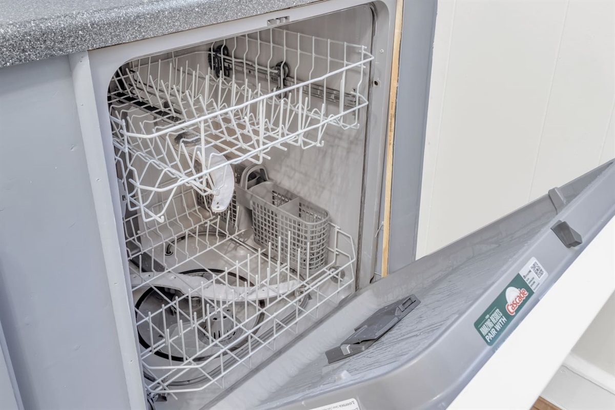 Dishwasher with clean interior for guest use.