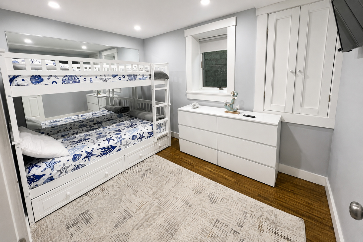 Bedroom 4 (basement) with bunk bed and smart TV