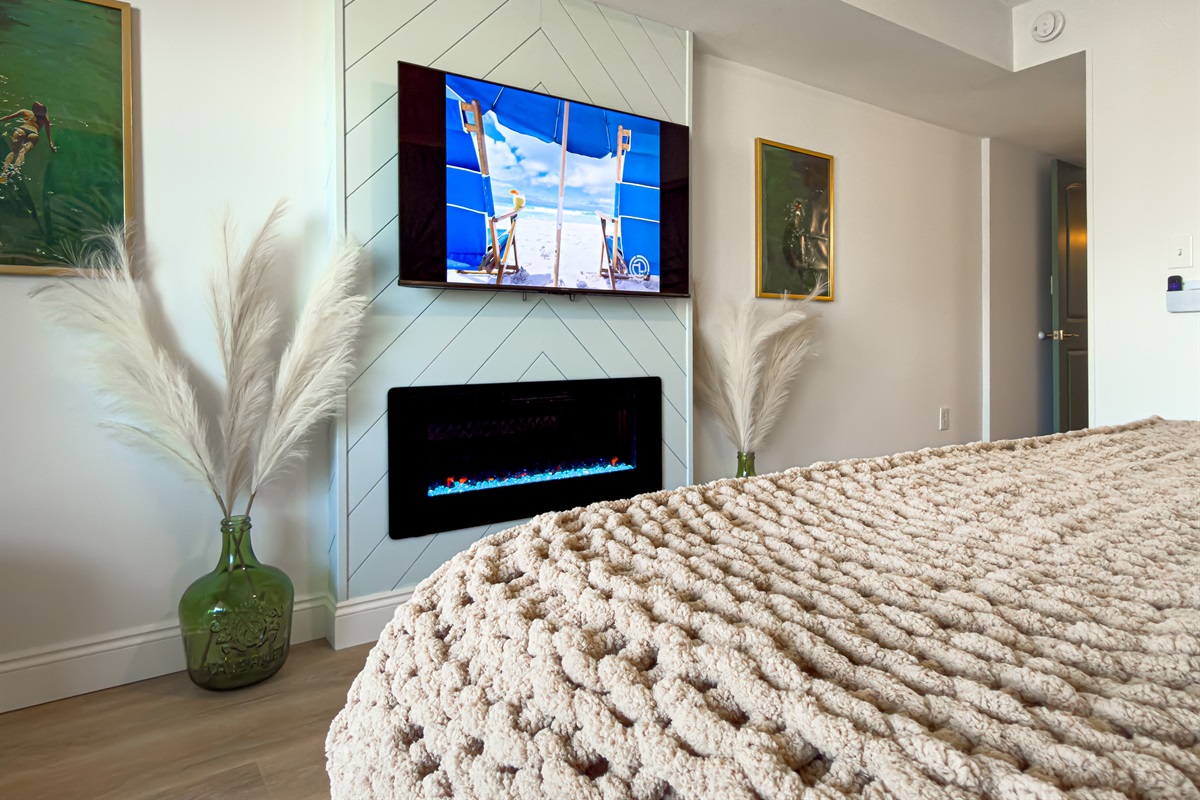 Unwind after a long beach day by turning on the electric fireplace. You can stream your favorite shows on the smart TV right from bed.
