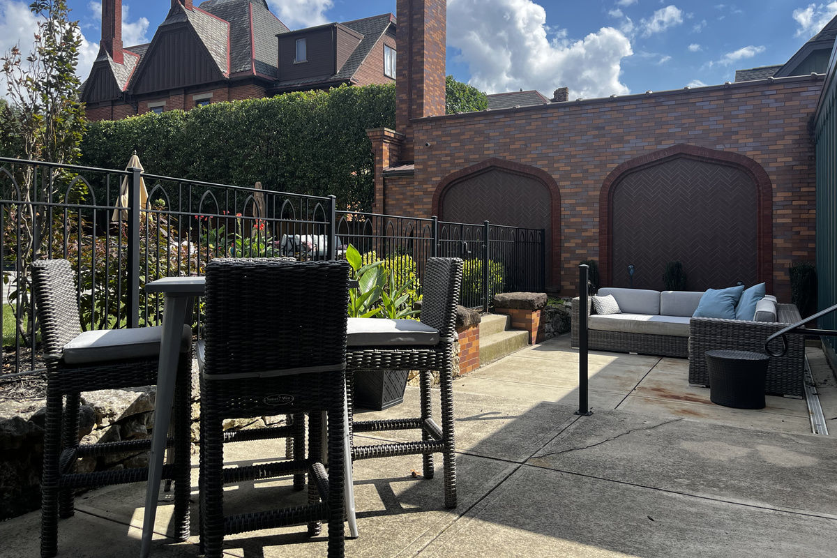 Bar-height table for four and lounge seating on the patio