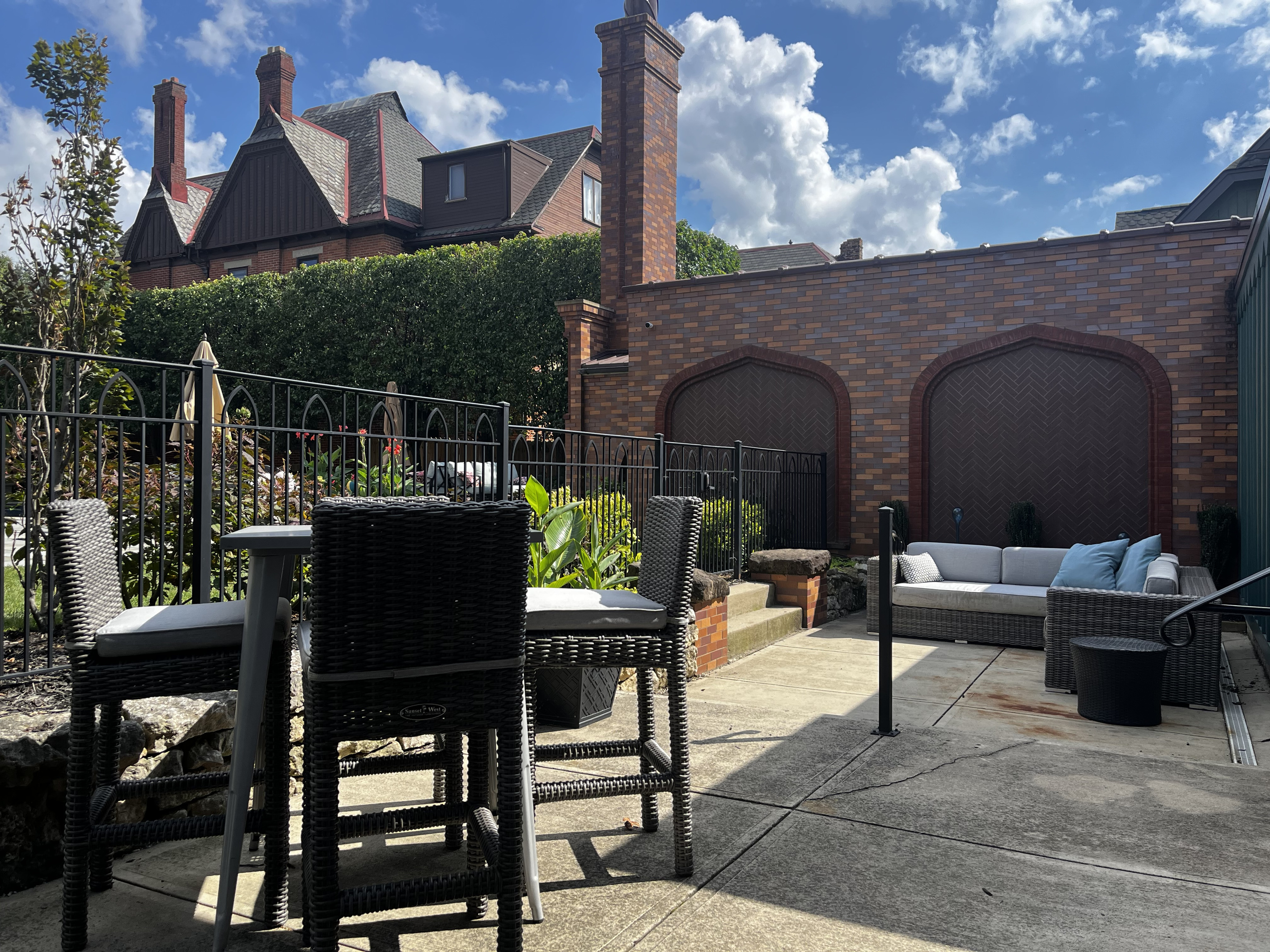 Bar-height table for four and lounge seating on the patio
