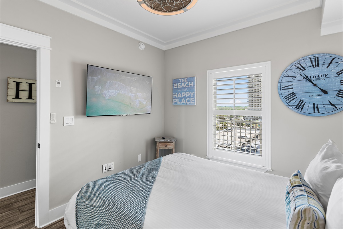 Guest Bedroom has Queen Bed, Smart TV, attached closet, and attached bathroom with shower/tub combo