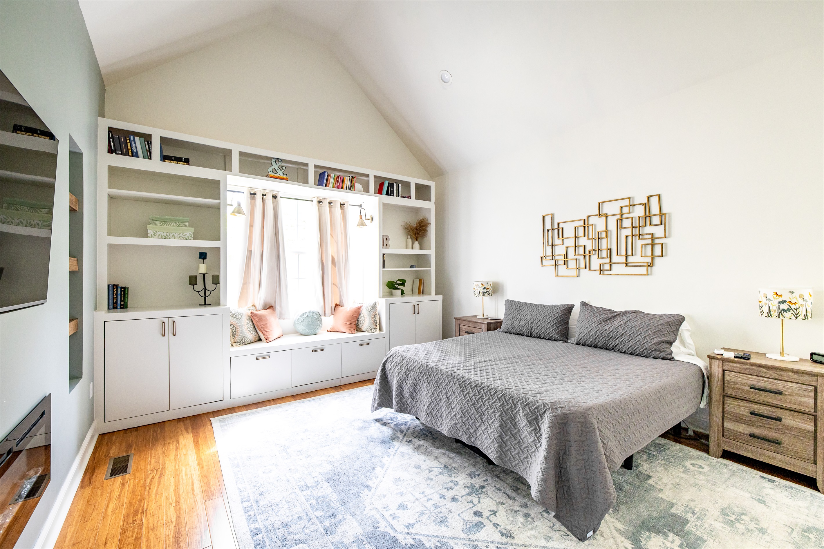 Main bedroom with king bed, TV, desk