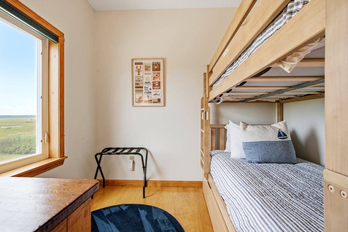 Twin-over-full bunk bed provides flexible sleeping arrangements for families and groups.