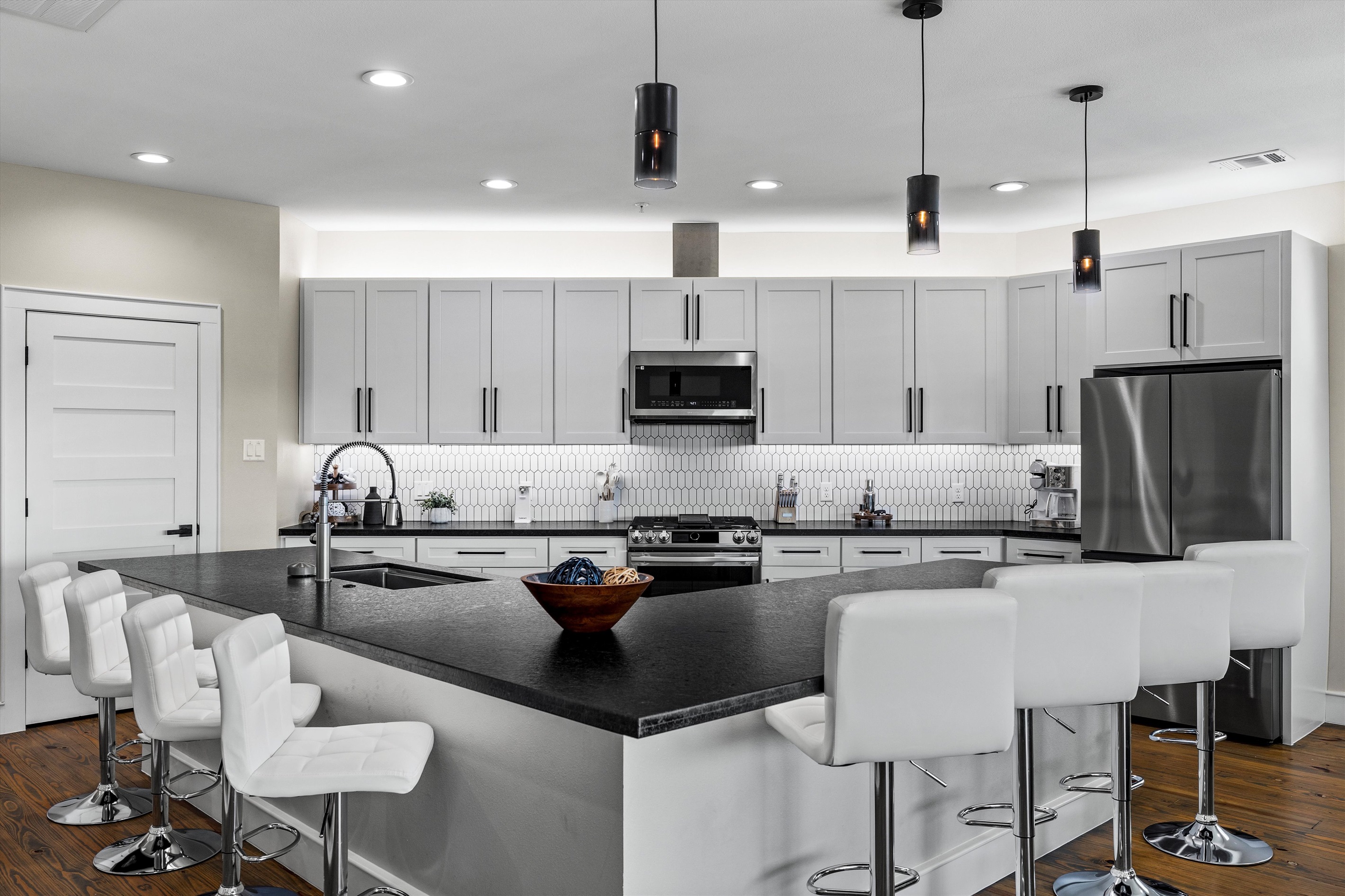 Gourmet Kitchen: Modern elegance awaits with sleek finishes and inviting bar seating for meaningful gatherings!