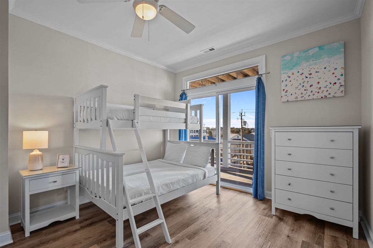 2nd floor bedroom #1 with 1 double and 1 twin bunk beds, balcony access and intracoastal waterway views