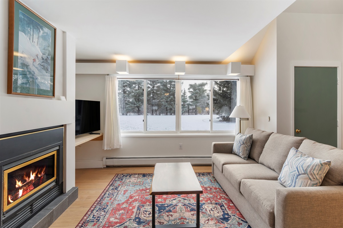 Living Room- Warm up with the fireplace and watch TV with the family