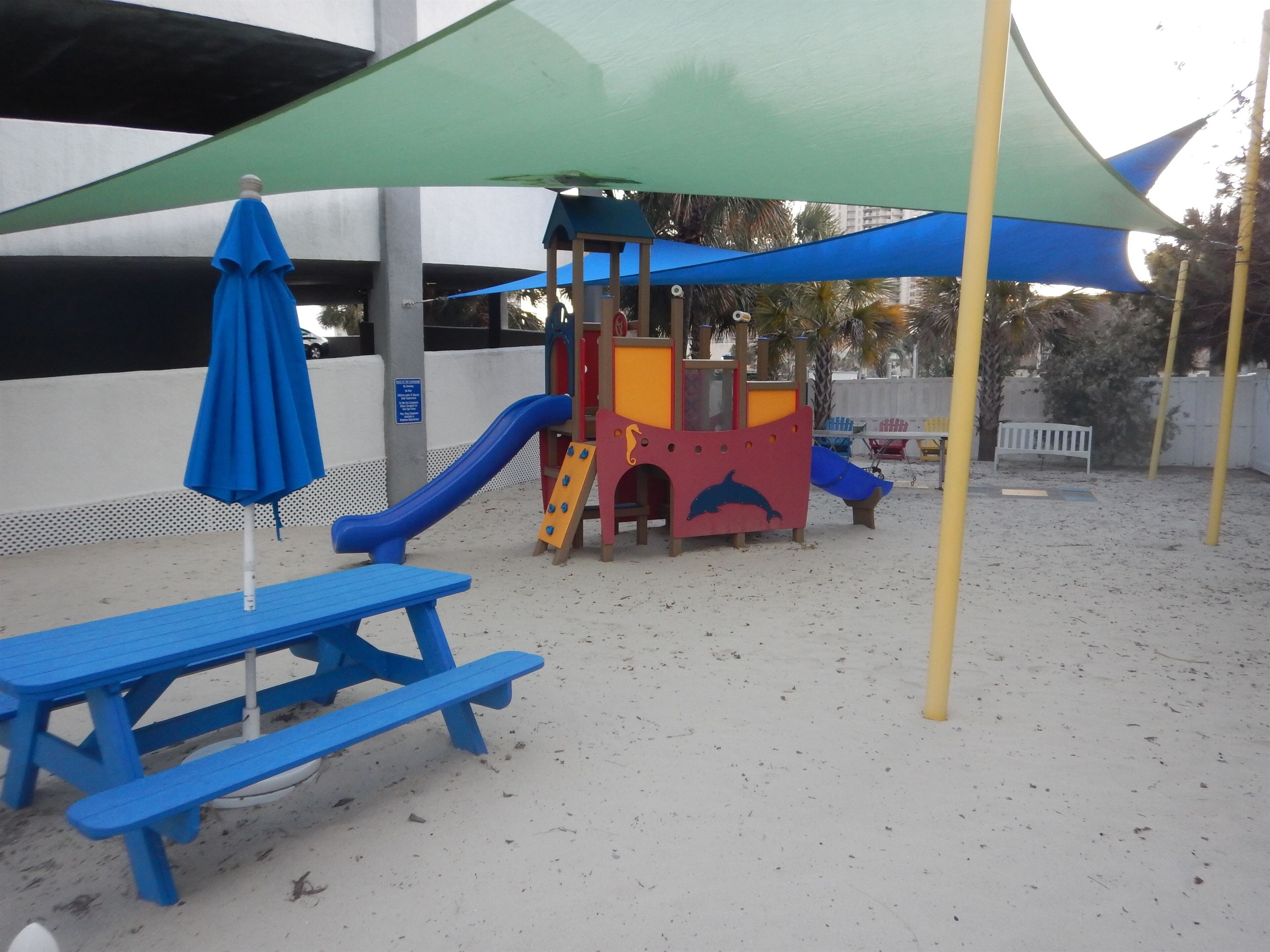 Playground with picnic tables, ping pong and foosball