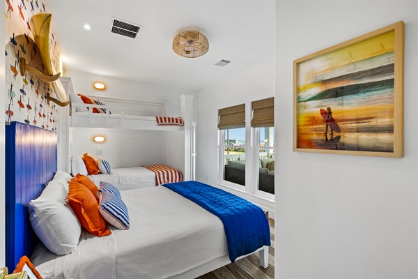 The Sunrise Surf bedroom has some of the best views! Enjoy a 43" TV and bunk bed reading lights and personal charging stations.