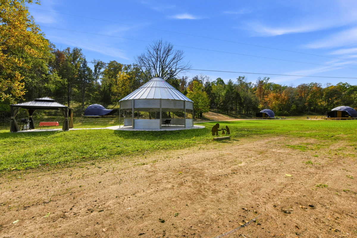 Enjoy a shared outdoor gathering space at the gazebo, surrounded by the natural setting.