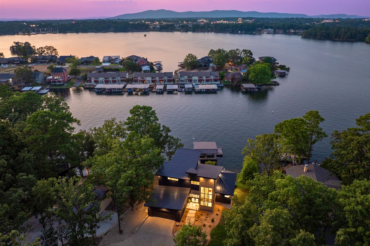 The ultimate lakeside retreat, this home offers multiple outdoor living spaces for enjoying the serene water views.