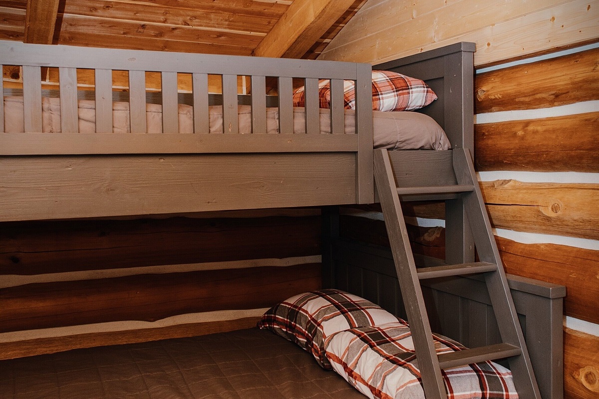 The bunk house, located behind the main house, features a twin over full bunk bed.
