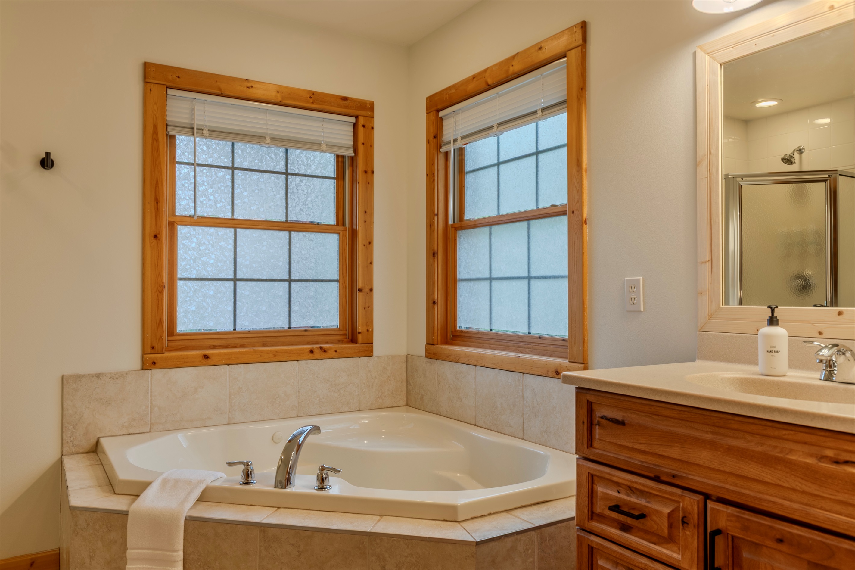 Master Bedroom ensuite with soaking tub & shower.  Shampoo, conditioner and body wash are provided during your stay.