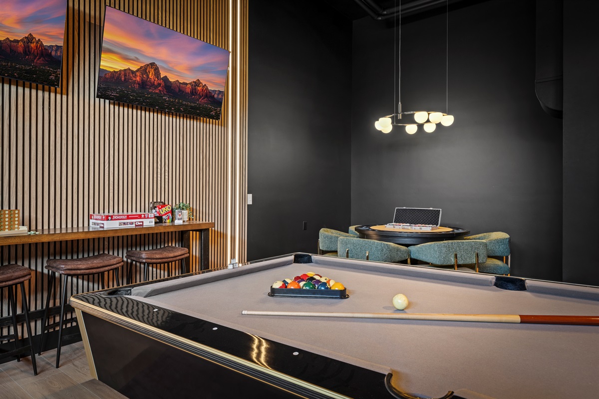 Game night, elevated—pool table, bar seating, and plenty of space to hang out.