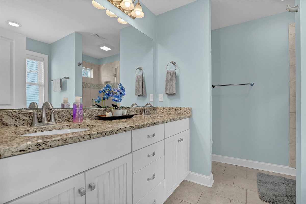 Dual vanities and bright lighting make getting ready for dinner a breeze.